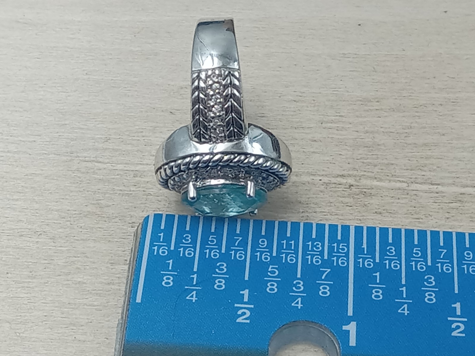 Sterling Silver Ring w. Blue Topaz Oval Center Stone & Clear Trim Stones: Size 6