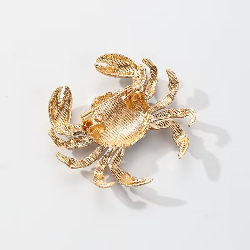 Blue and White Enamel Crab Brooch – Artistic Gold‑Tone Design-Elegant
