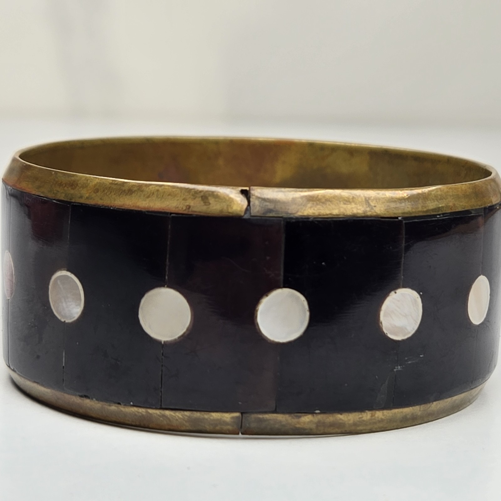 Vintage 8 Inch Gold Tone Metal Black Stone And White Shell Inlay Bangle Bracelet
