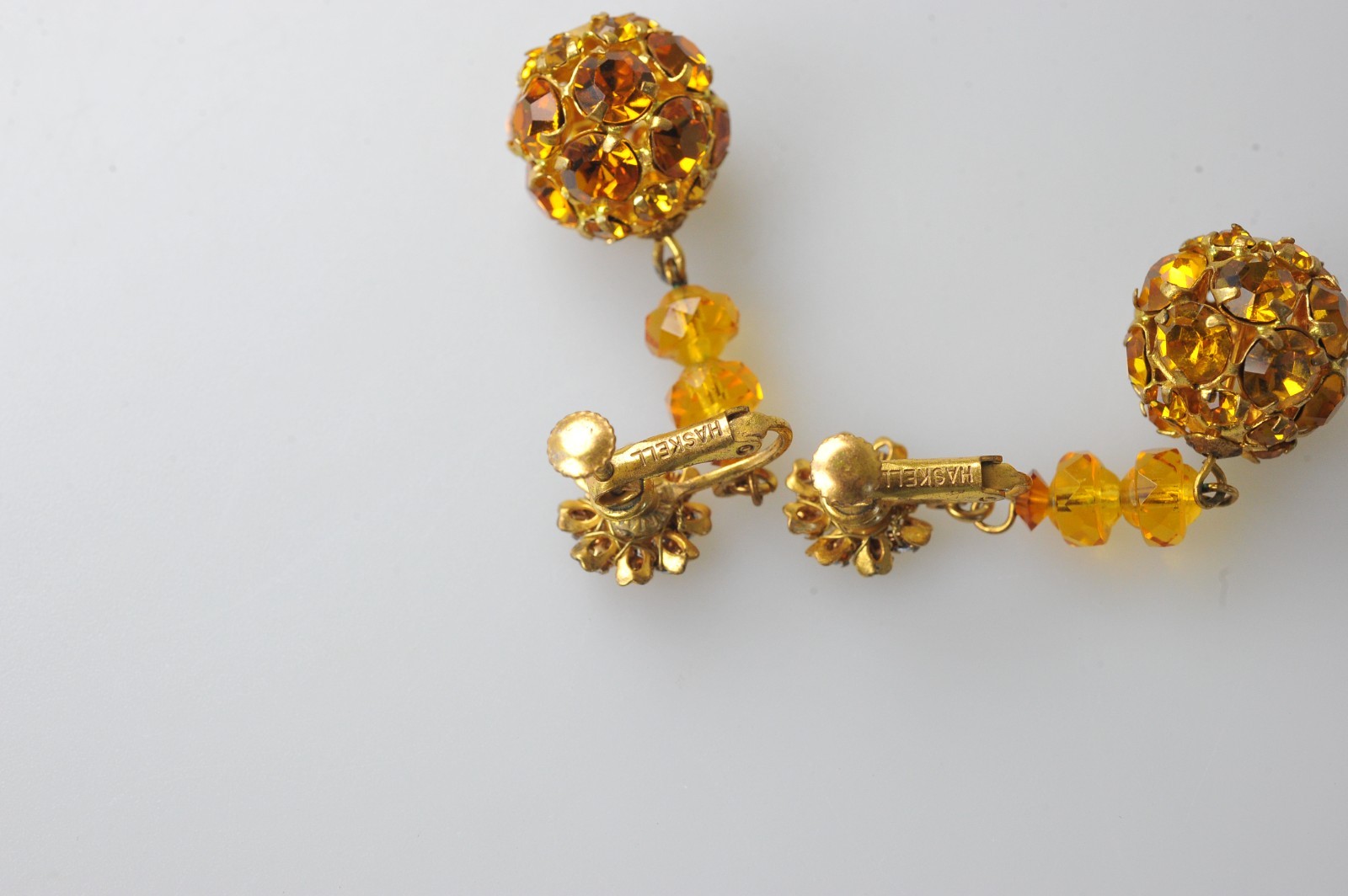 Vtg signed Miriam Haskell rhinestone Gold Tone drop clip earrings amber color
