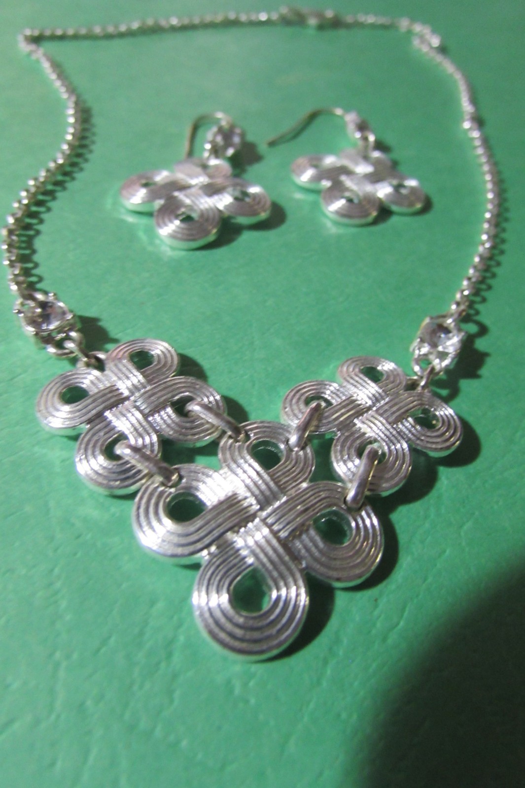 LMN 17″ necklace and almost 2″ pierced earring set silvertone swirl w/rhinestone
