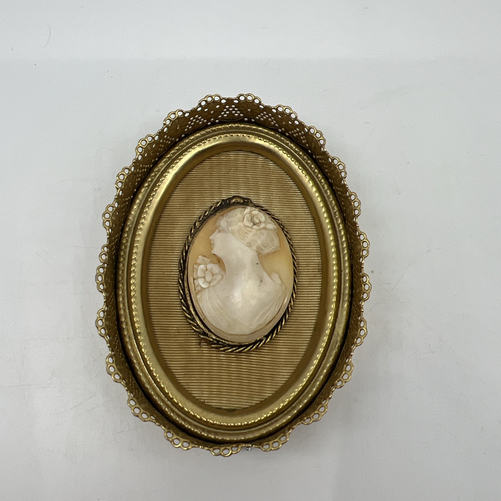 Vintage Oval Shell Cameo Portrait in Brass Ornate Filigree Frame Beige White