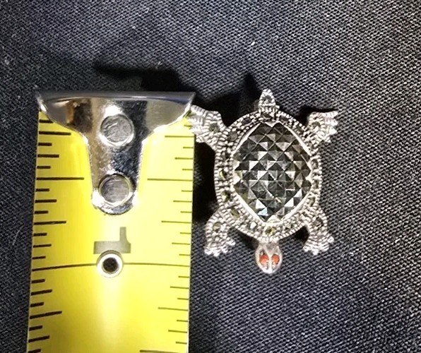 Sterling Silver Turtle Brooch features Marcasite Accents and Red Coral Eyes