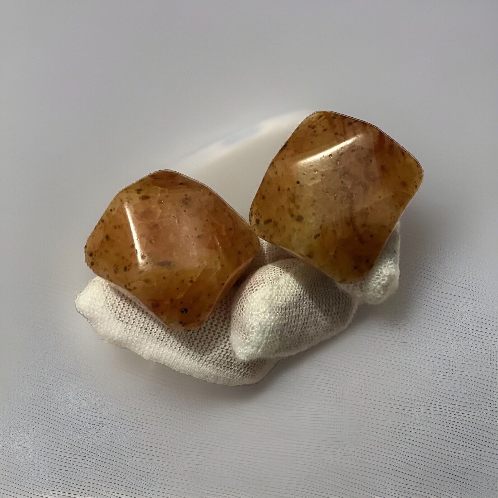 Bakelite Carved Apple Juice Clip On Earings About I 1/4 Inch Across 3/8 Thick.