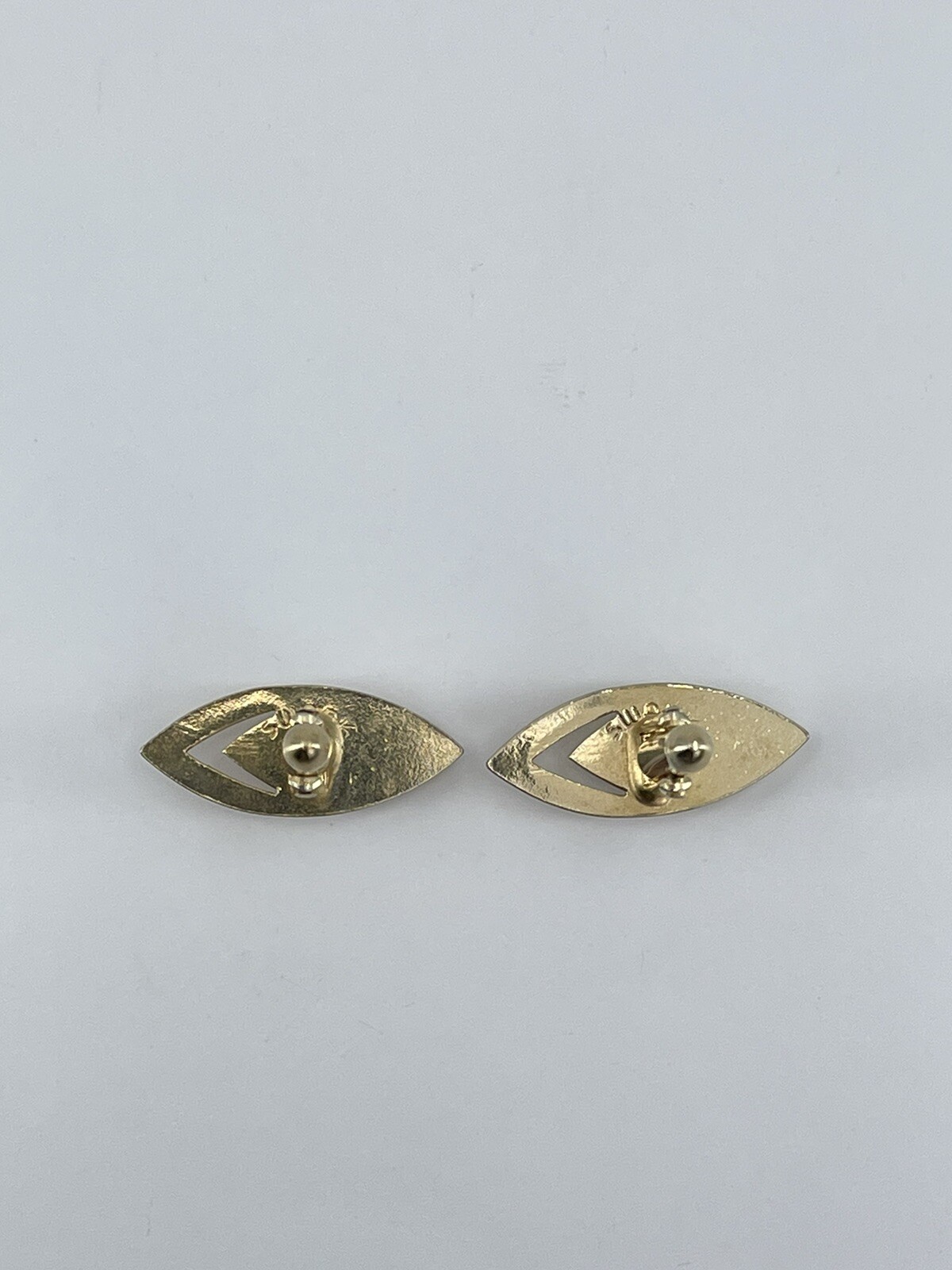 Vintage Swank mens cufflinks torpedo shaped raised cutout design gold tone 3/4″