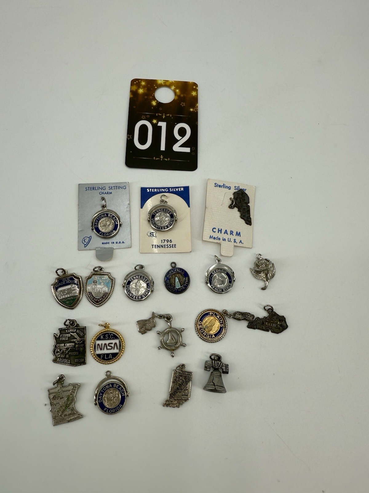 collection of vintage sterling silver souvenir charms from various locations