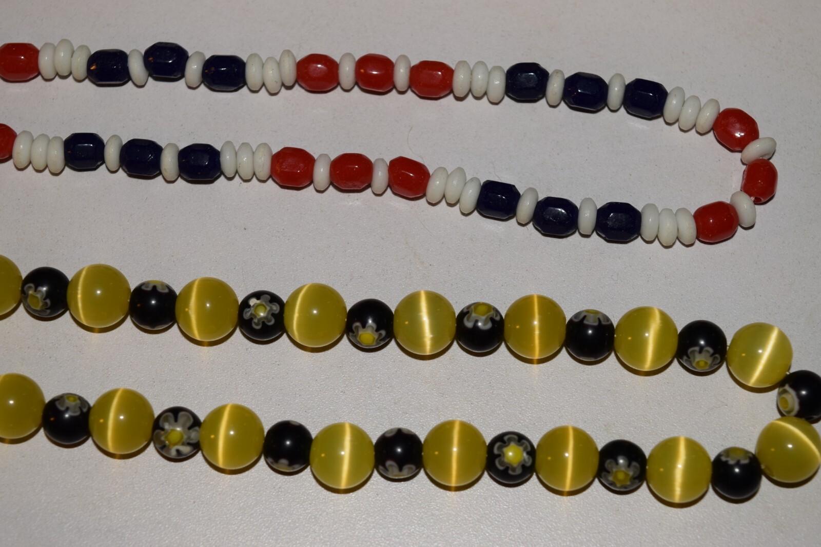 Vintage to now lot of 4 plastic beaded necklaces not sure what the 2 short ones