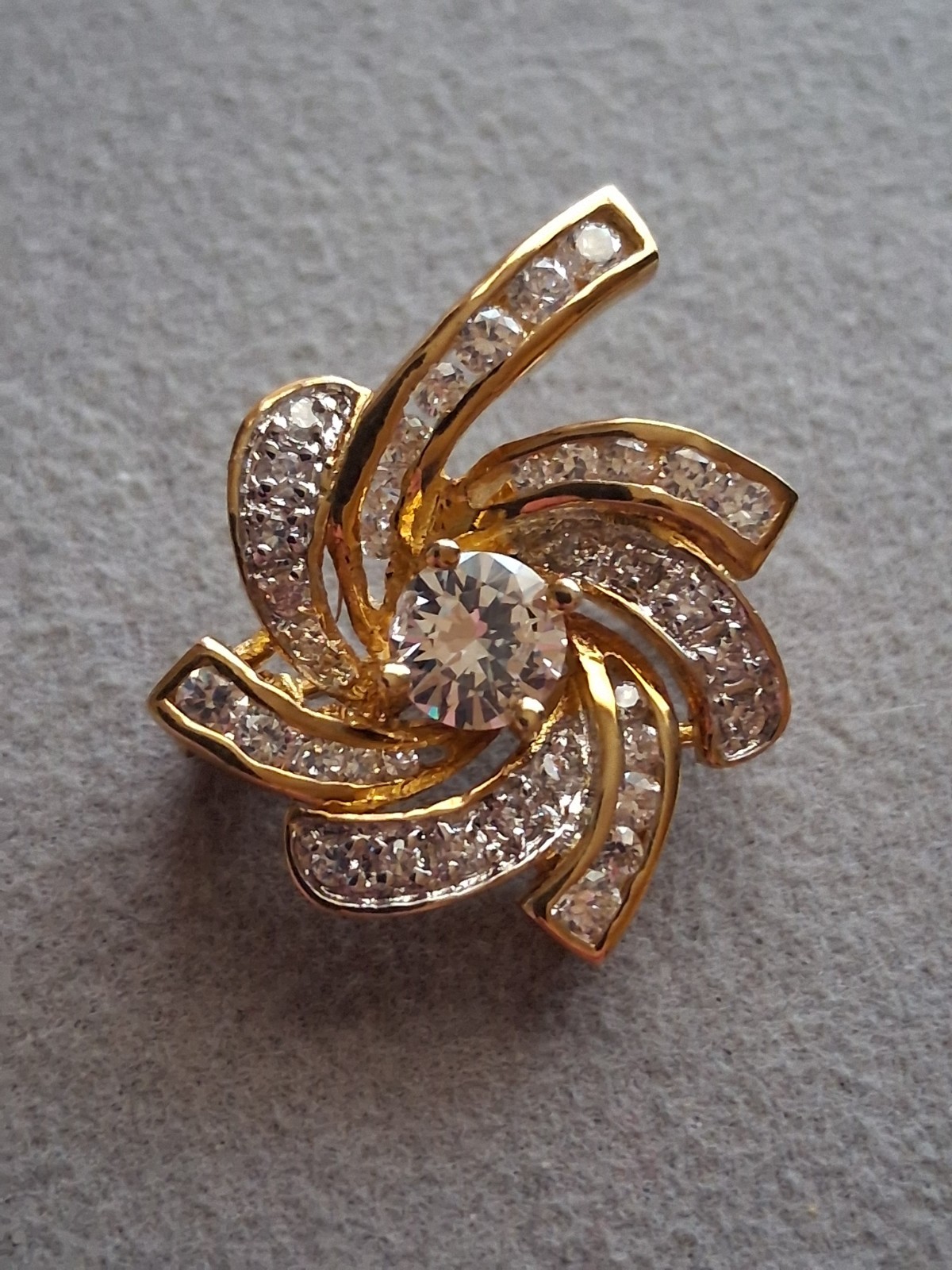 Pinwheel cubic zirconia embellished gold plated convertible brooch/pendant