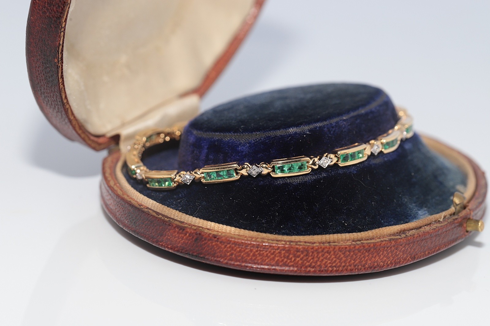 Vintage Circa 1980s 18k Gold Natural Diamond And Caliber Cut Emerald Bracelet