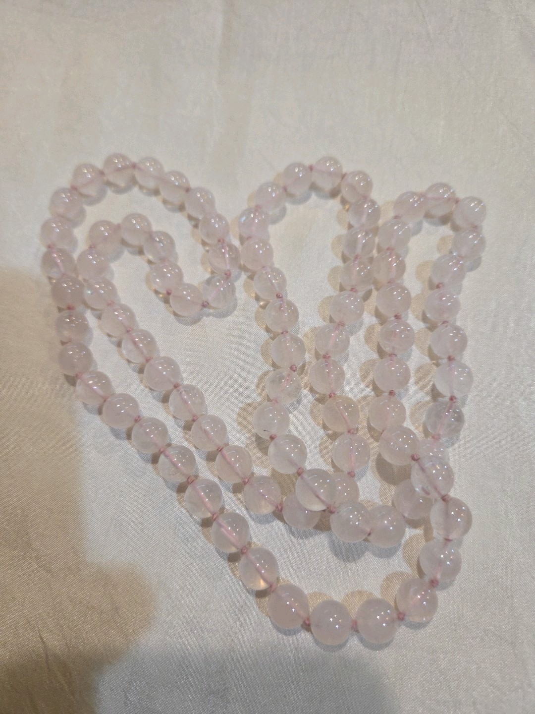 Delicate Vintage rose quartz necklace, continuous strand 31 inches in length.