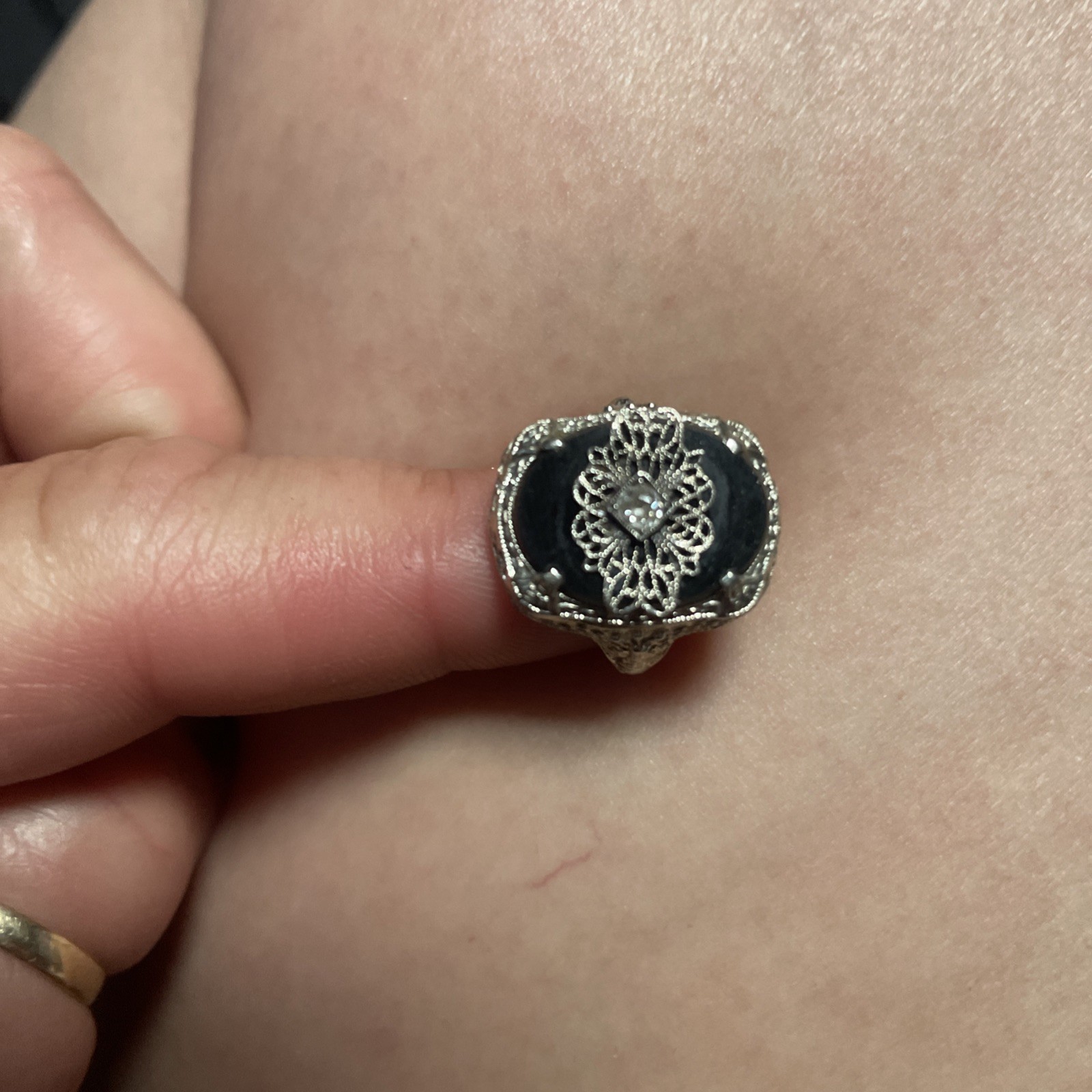 An authentic 14k white gold Art Deco onyx and diamond ring stamped “A&S”