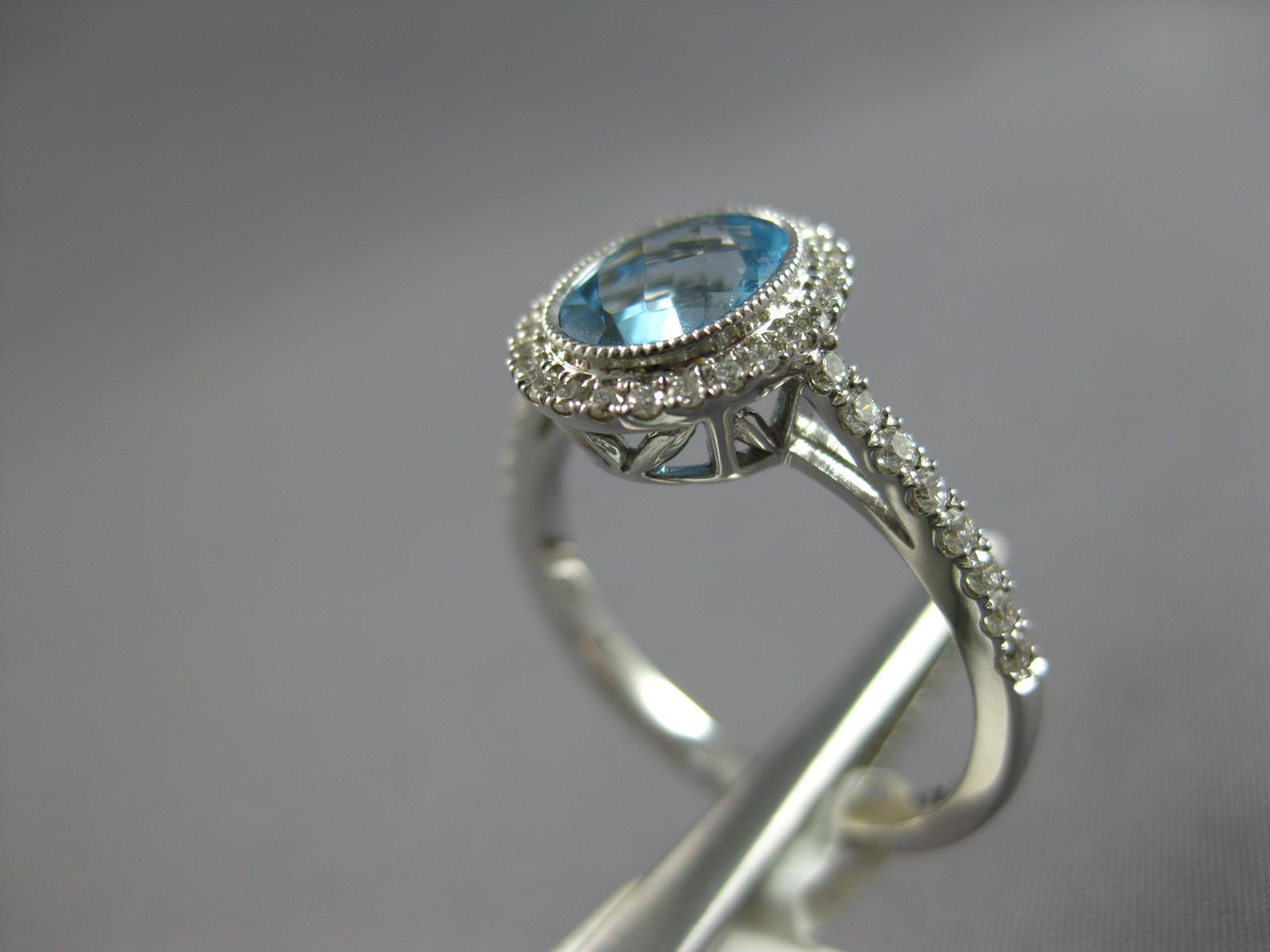 1.62CT DIAMOND & AAA BLUE TOPAZ 14KT WHITE GOLD 3D OVAL & ROUND ENGAGEMENT RING