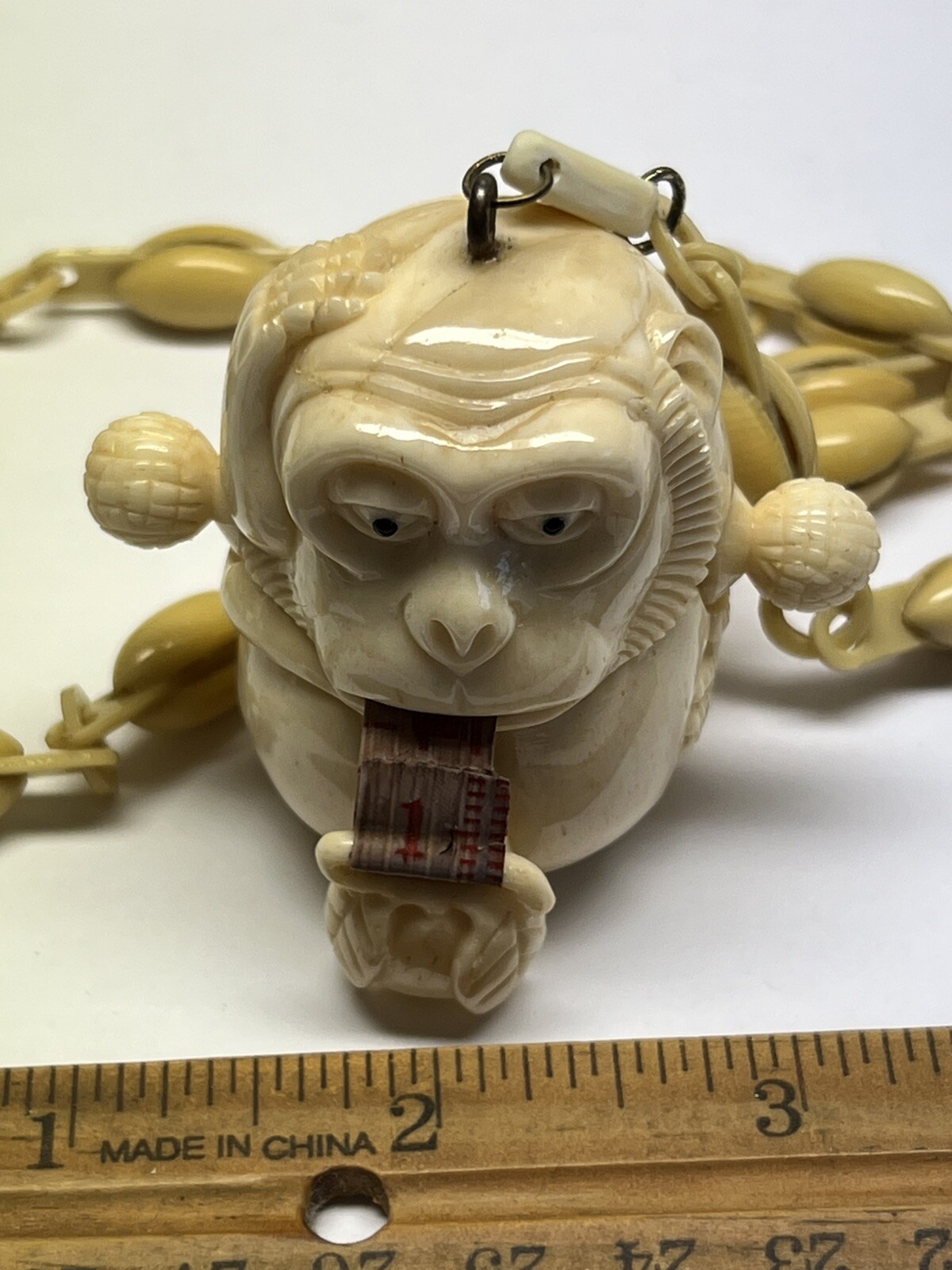 ANTIQUE ART DECO MONKEY NECKLACE TAPE MEASURE CELLULOID CHAIN PENDANT WHIMSICAL
