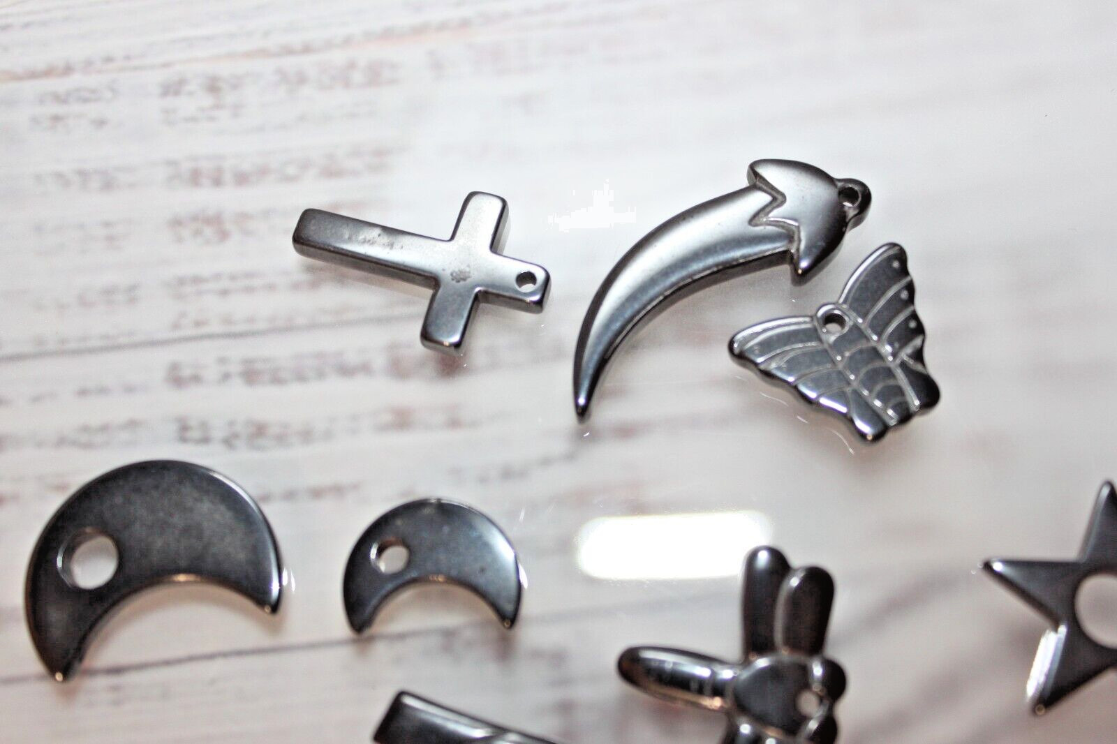 Lot of 8 Hematite pendant charms butterfly star moon dragonfly and more