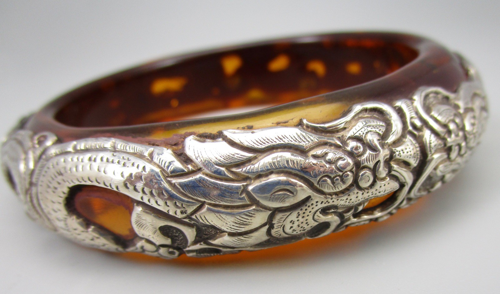 TIBET REPOUSSE STERLING SILVER ON FAUX AMBER RESIN DOUBLE DRAGON BANGLE BRACELET