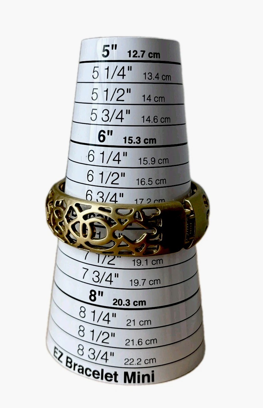 Open filigree hinge bracelet/ brushed antique gold tone/ size 6.75
