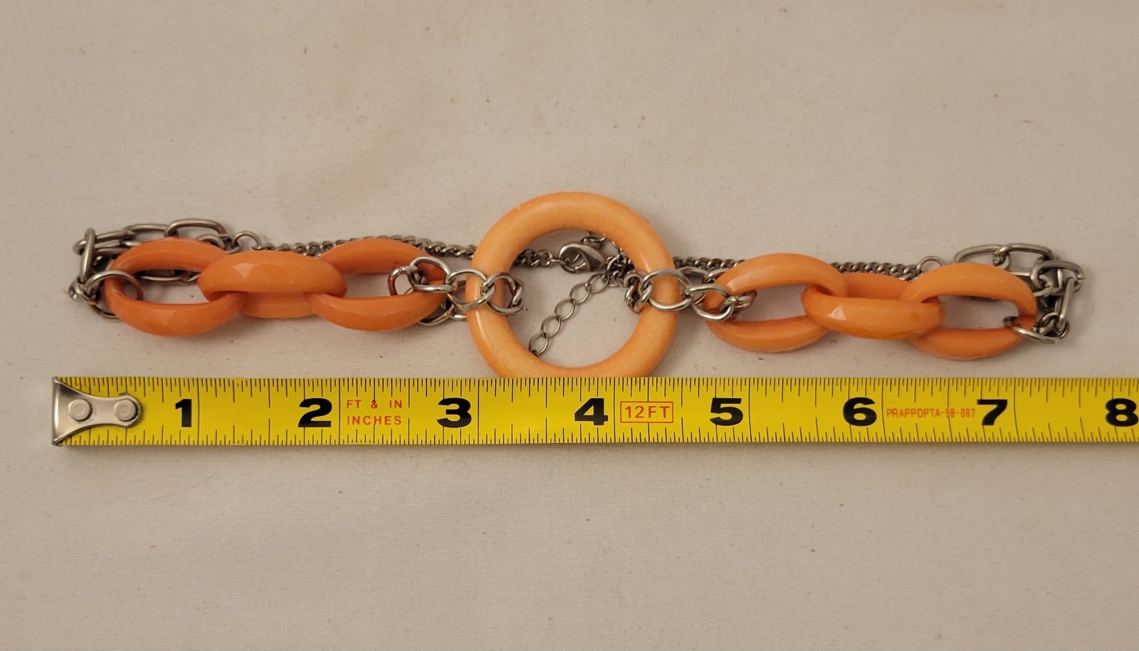 Gwen Women’s Silver Tone Necklace with Salmon Colored Large Plastic Links