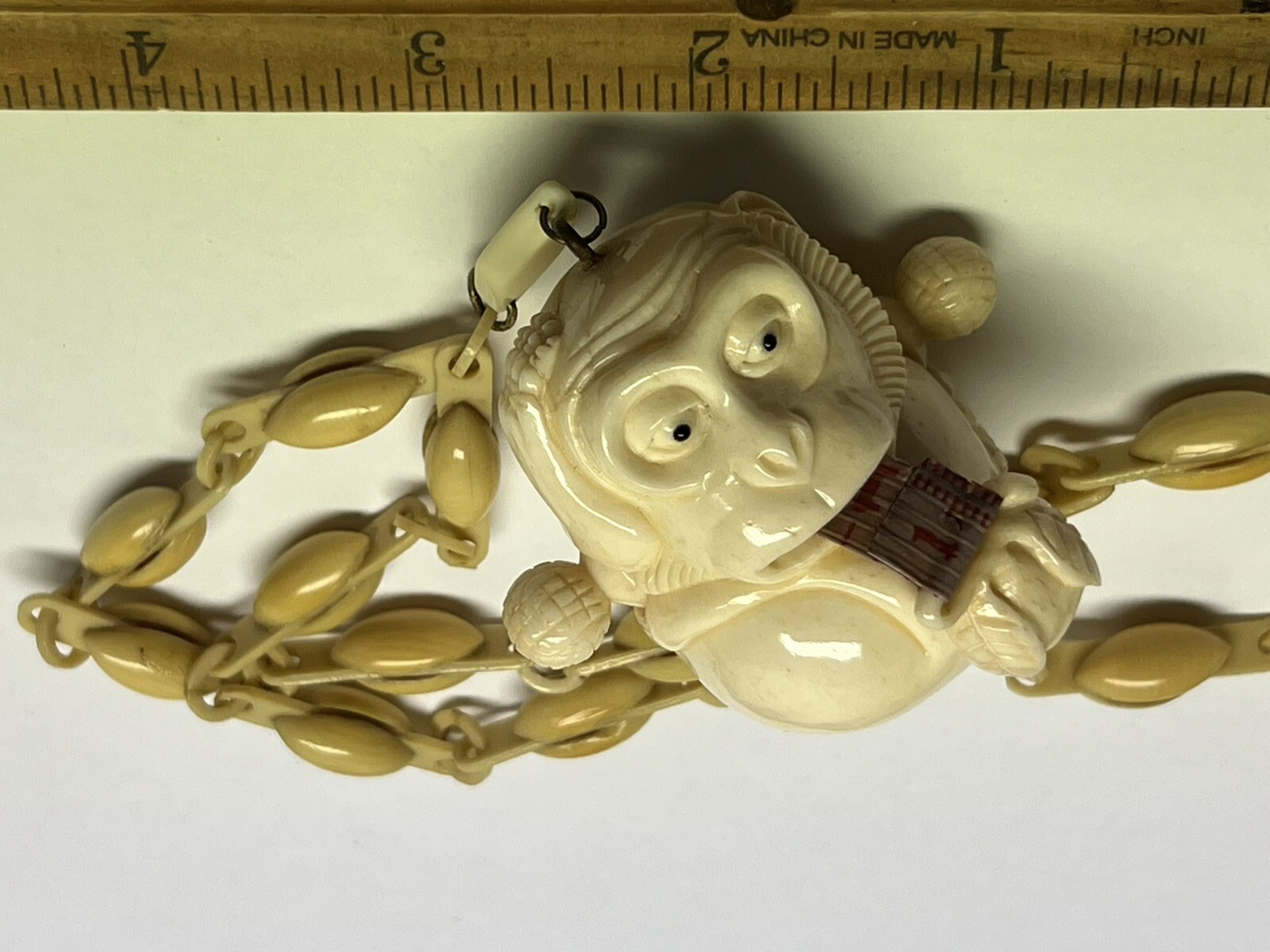 ANTIQUE ART DECO MONKEY NECKLACE TAPE MEASURE CELLULOID CHAIN PENDANT WHIMSICAL