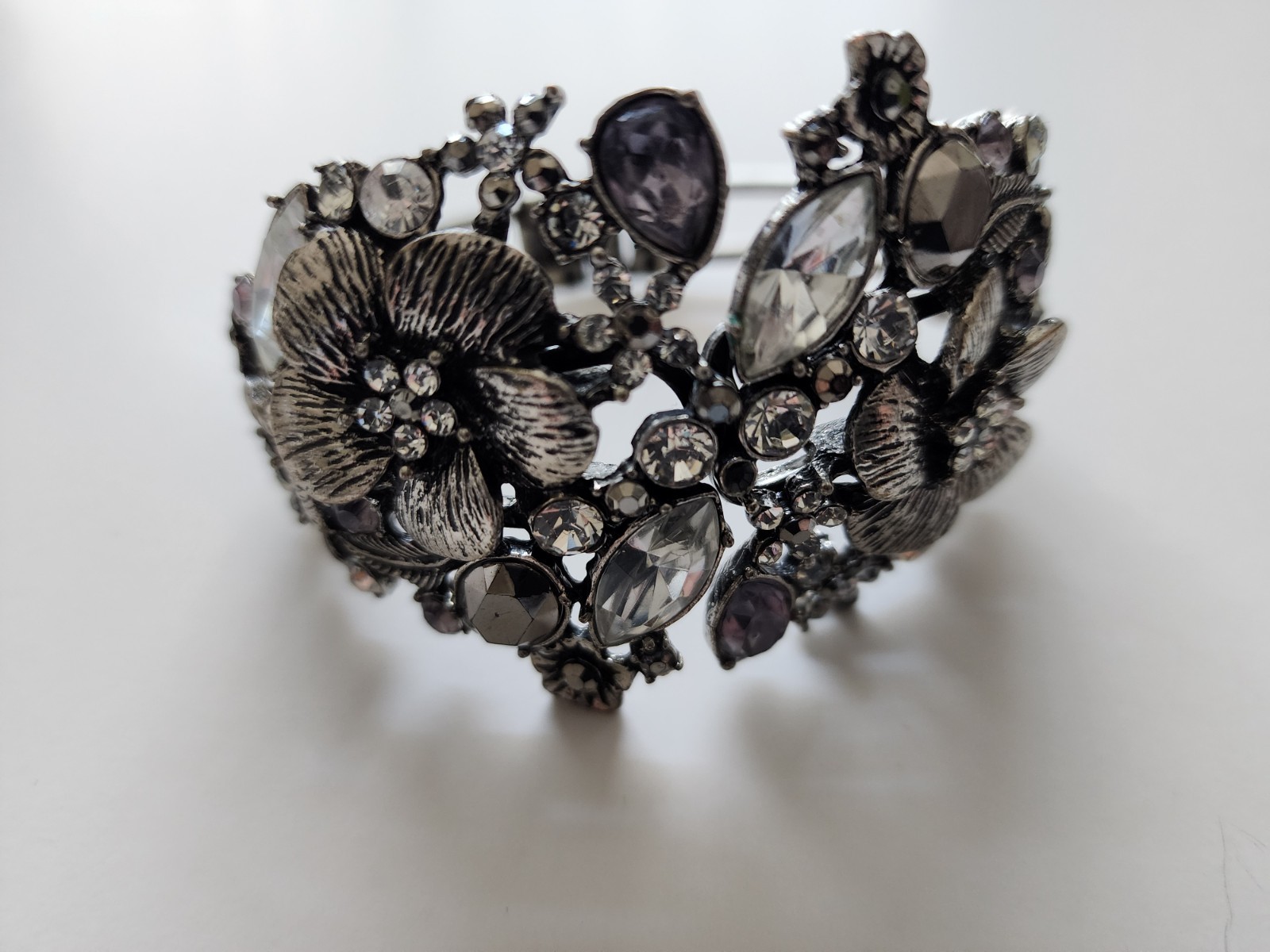 Vtg. rhinestone bracelet, front opening, hinged spring, silver tone metal