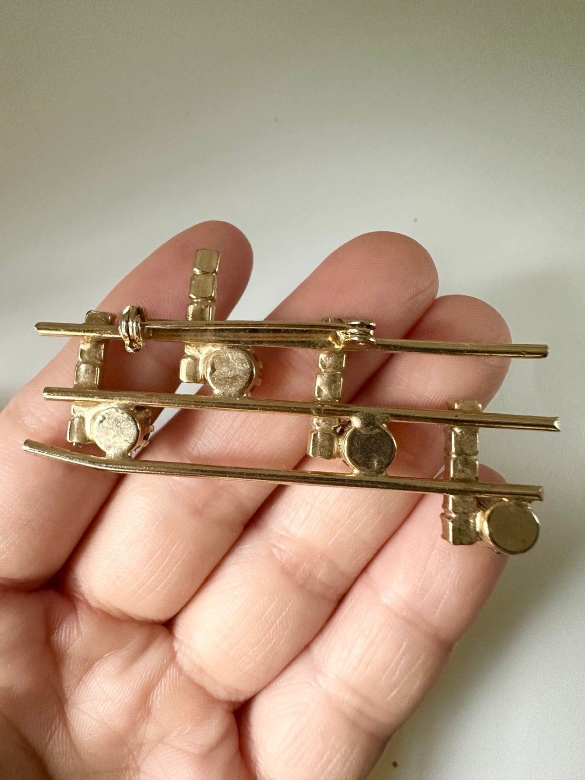 Vintage gold tone rhinestone music notes brooch