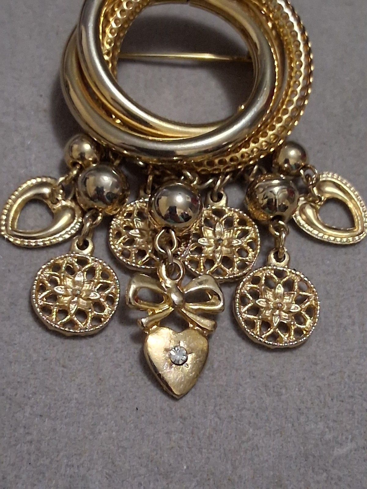 Interlocking circle charm brooch, gold-toned dangle drop charms