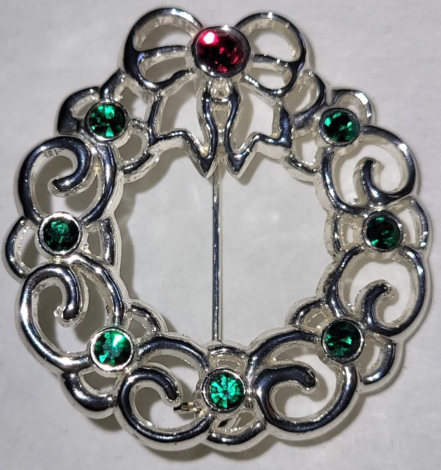 Silvertone Christmas Wreath With Red Green Stones 1 1/2″ Across Bow On Top