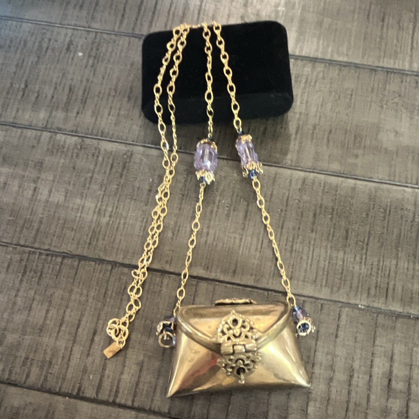 Antique Iris Lane pillow purse, necklace brass on gold filled chain.