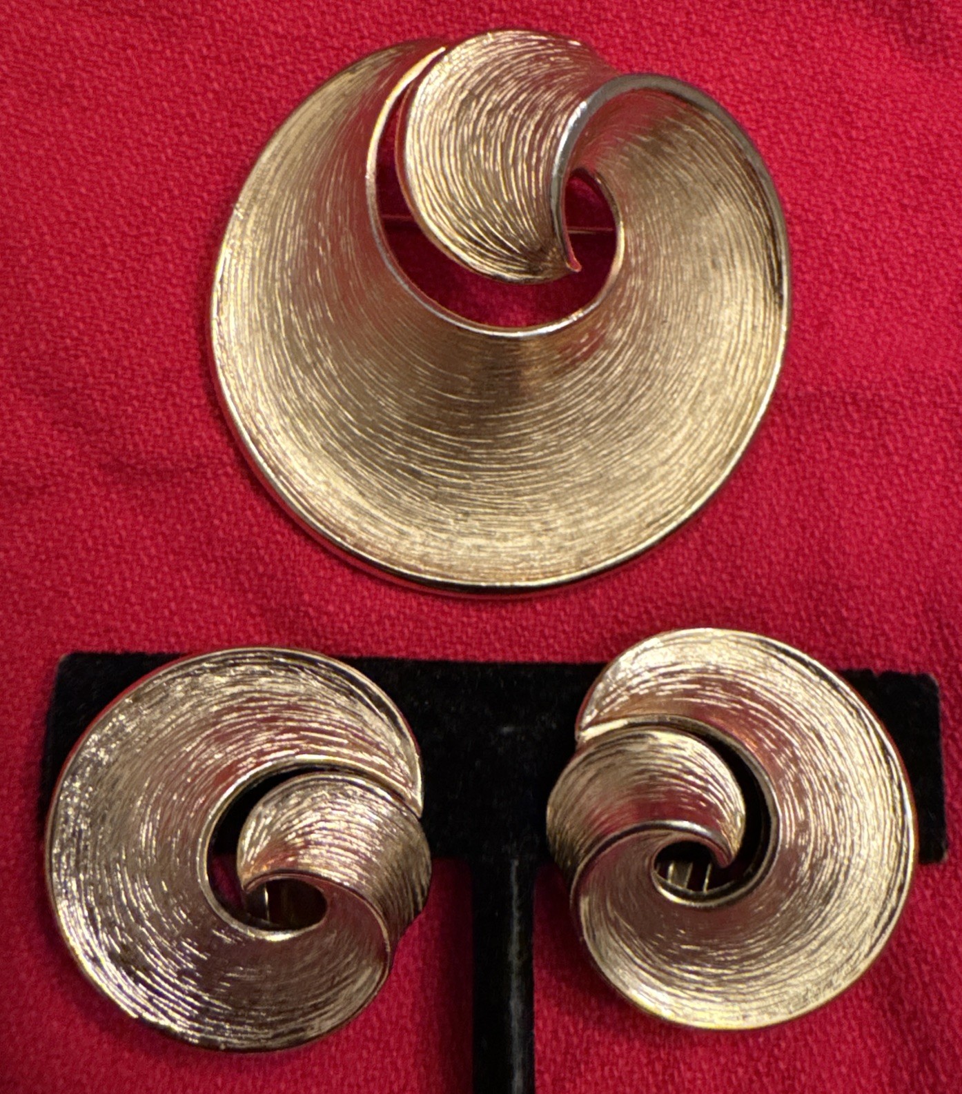Vintage Crown Trifari 1 3/4” golden swirl brooch with 1” clip on earrings