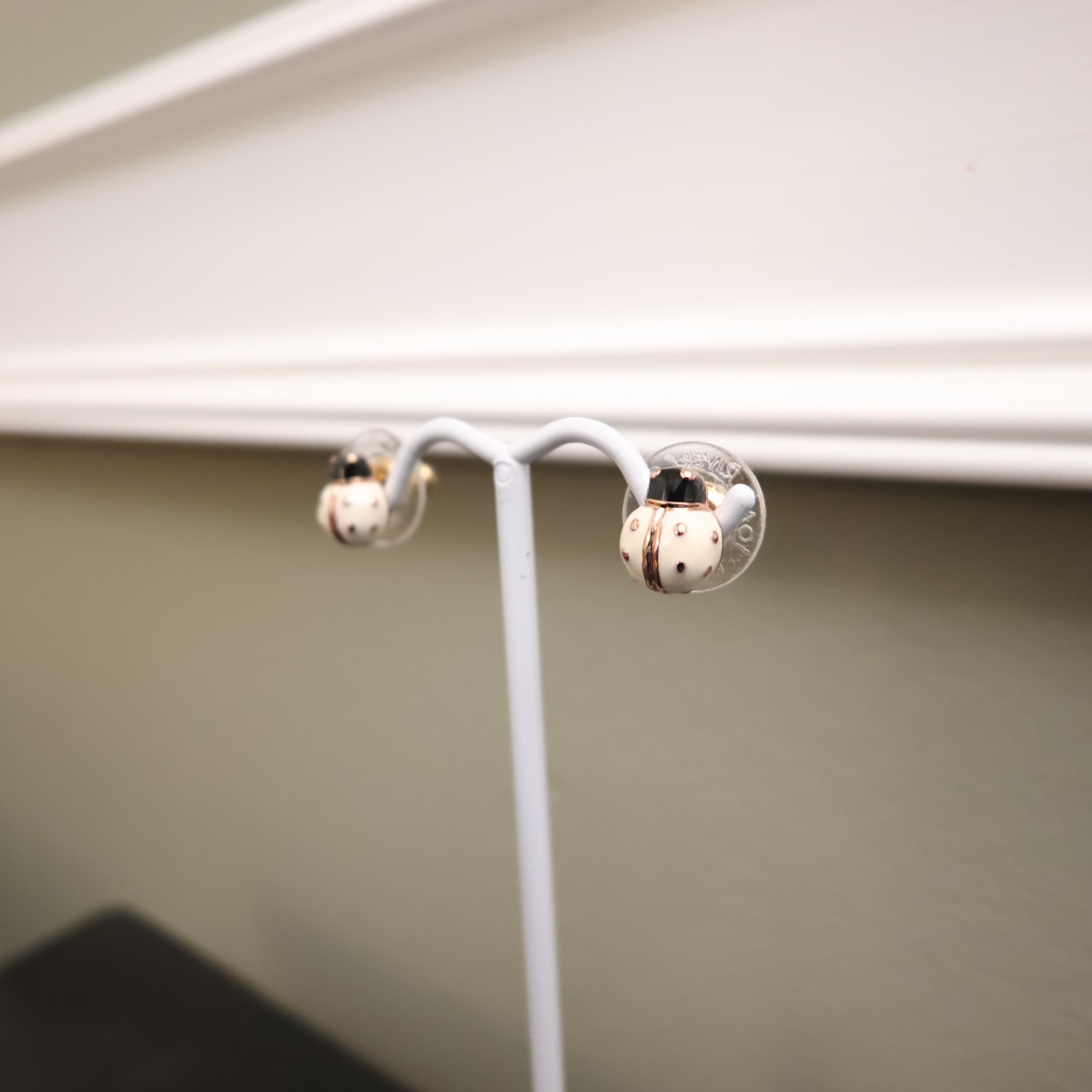Joan Rivers earrings ladybugs white black enamel signed rose goldtone studs