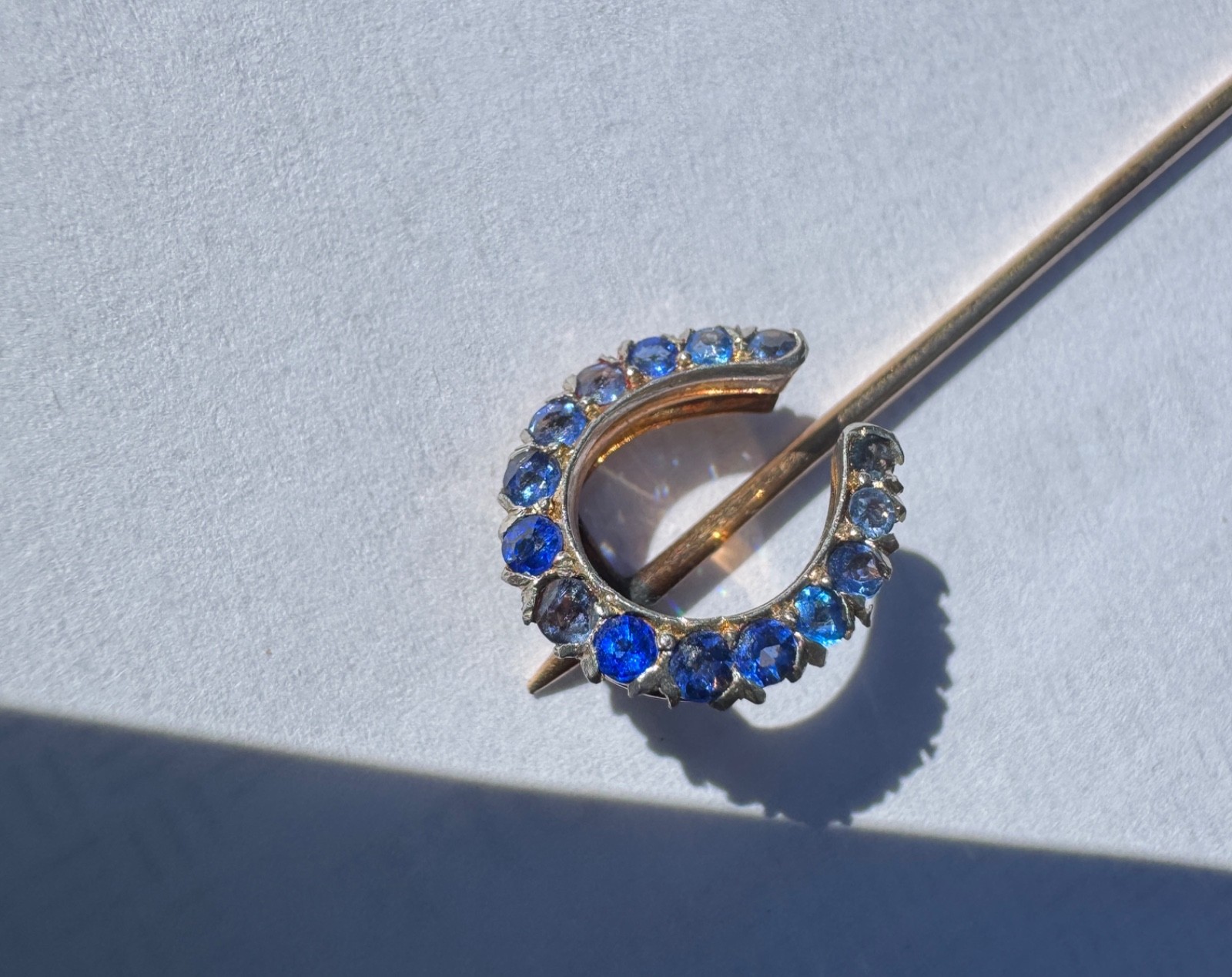 Antique 14K Y Gold Horseshoe Stick Pin w/ red garnet and blue glass 2.1 grams