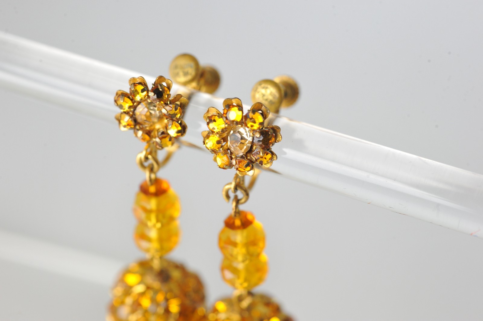 Vtg signed Miriam Haskell rhinestone Gold Tone drop clip earrings amber color