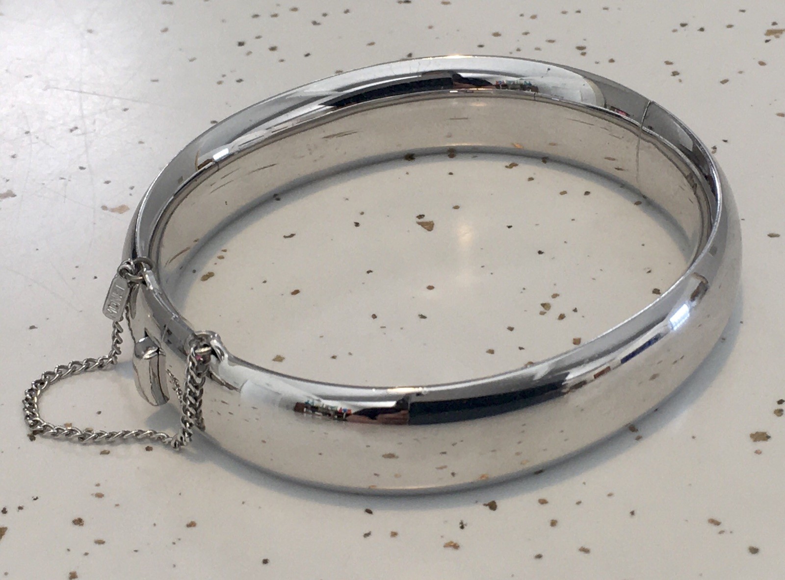 VTG MONET Sleek Silver-Tone MODERN Clasp Hinged BANGLE BRACELET w/ Safety Chain