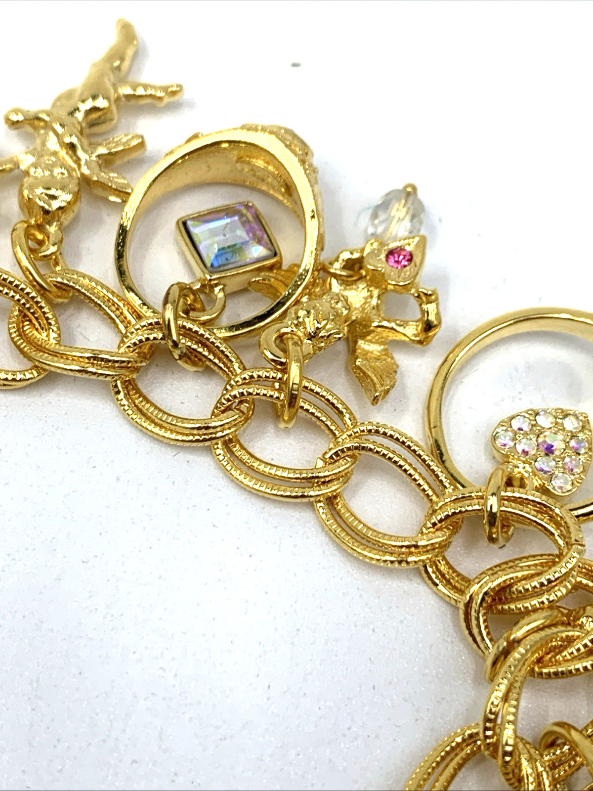 Kirks Folly Gold Tone Charm Bracelet Cupid Hearts Rings Crystals Angel