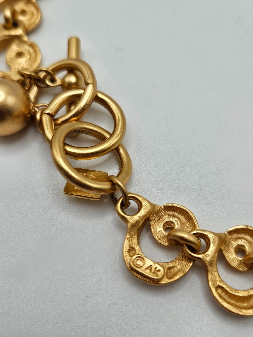 VINTAGE Anne Klein AK Matte Gold Tone Swirl Articulated Link Chain Necklace