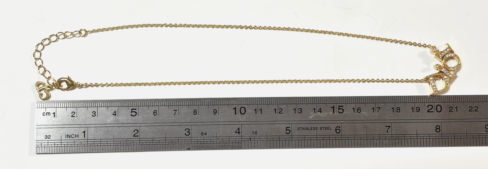 Christian Dior necklace pendant Features the DIOR logo rhinestones gold plating