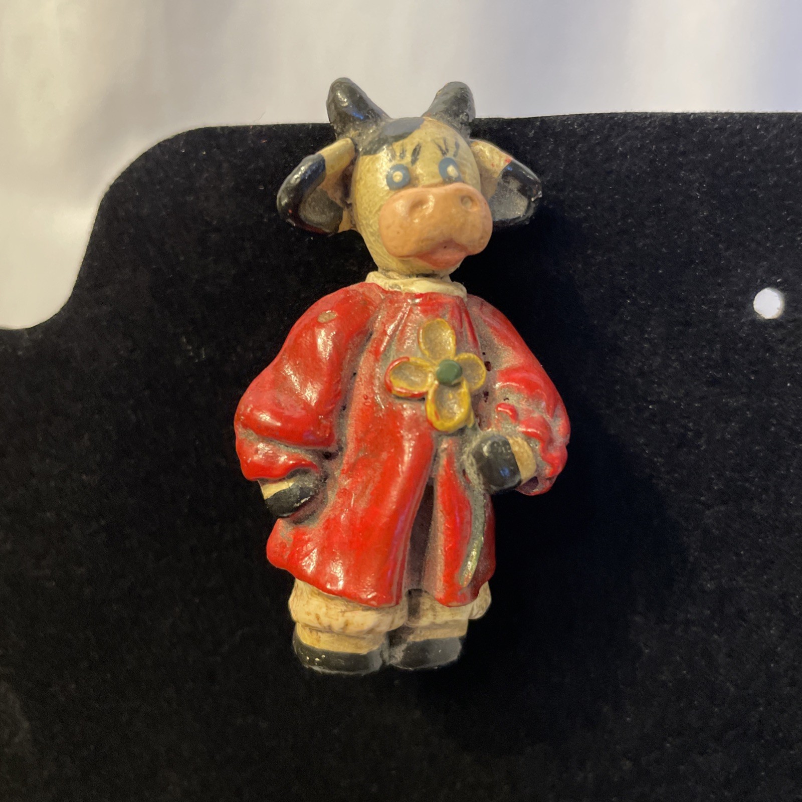 Decorative Pin Painted Ceramic Cow In Red Robe Holding Yellow Flower 2.25 in