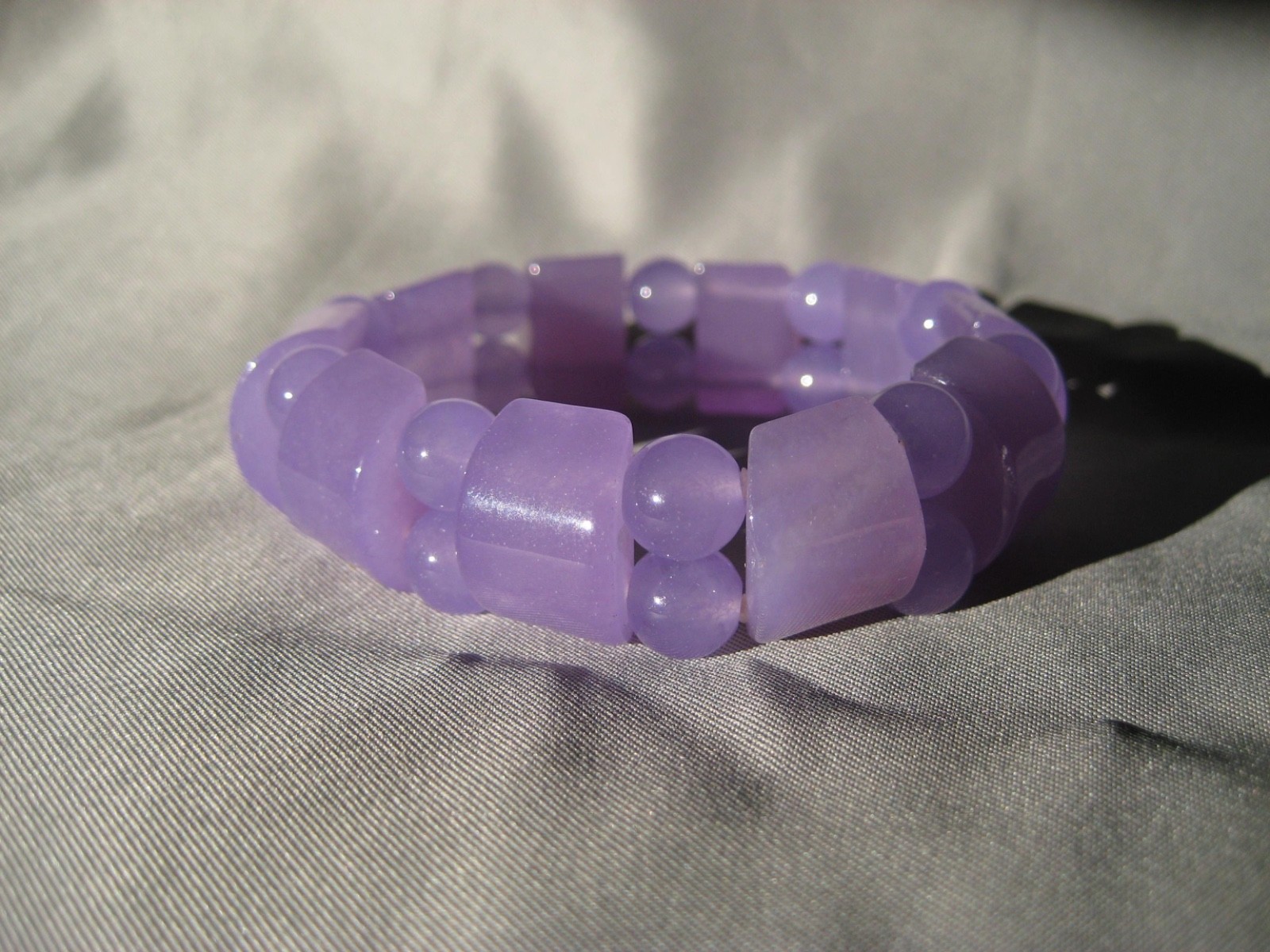 Colorful Fun Lavender Purple Jade strung on stretchy cord. 3/4″ W Bracelet 18