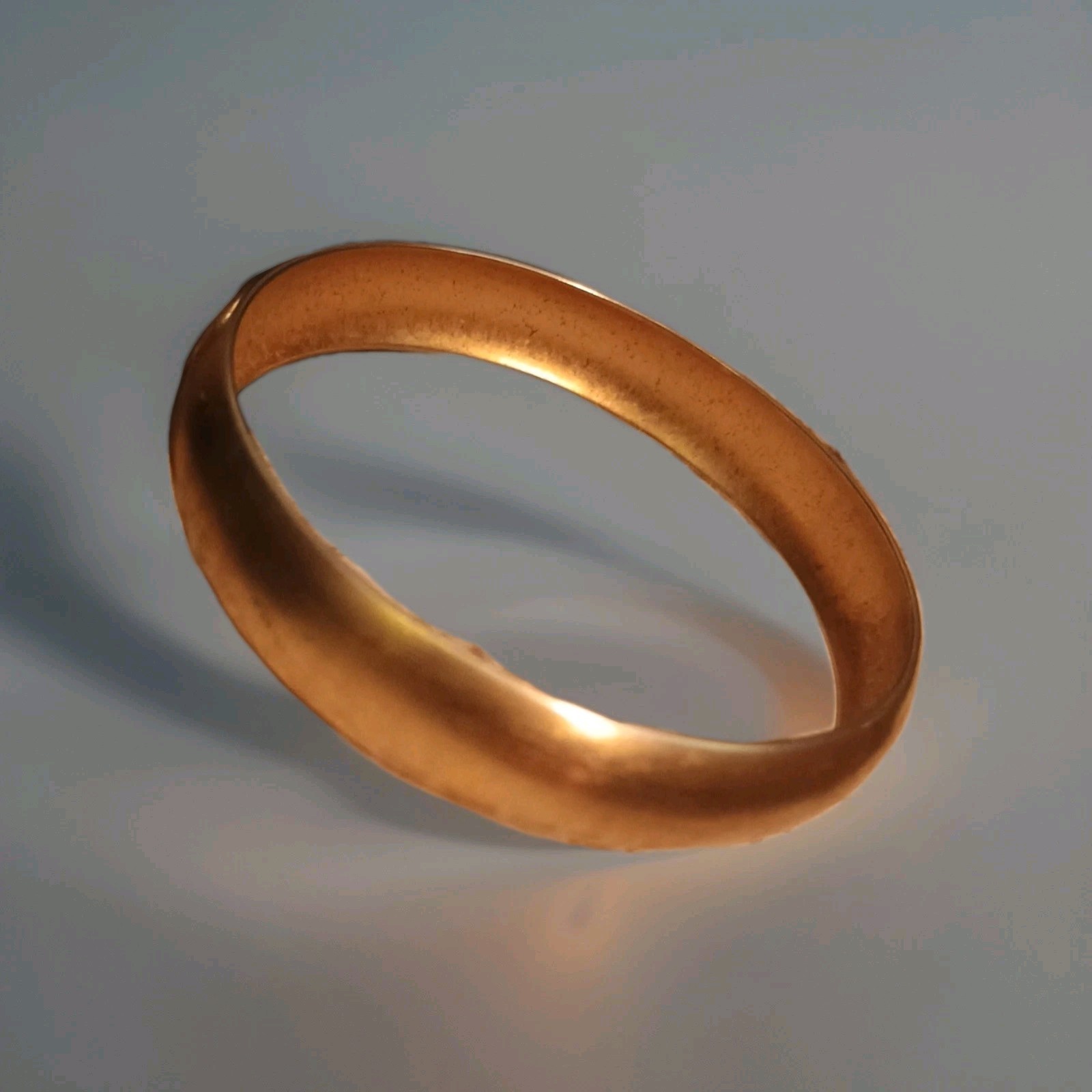 Monet polished gold-tone bangle bracelet. Solid plain finish, vintage