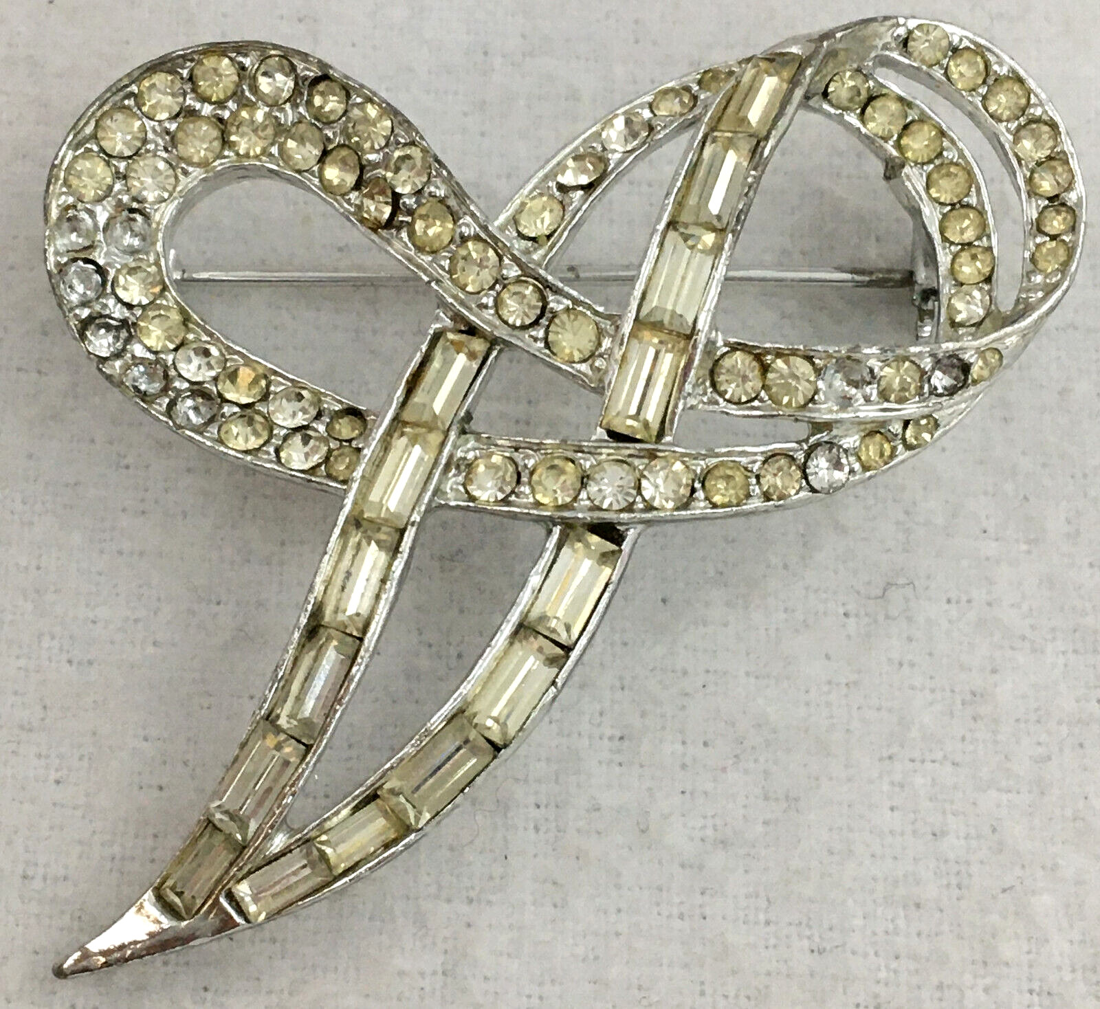 SilverTone Swirl Ribbon Brooch Pin With Clear Round with Bagette Crystals TG
