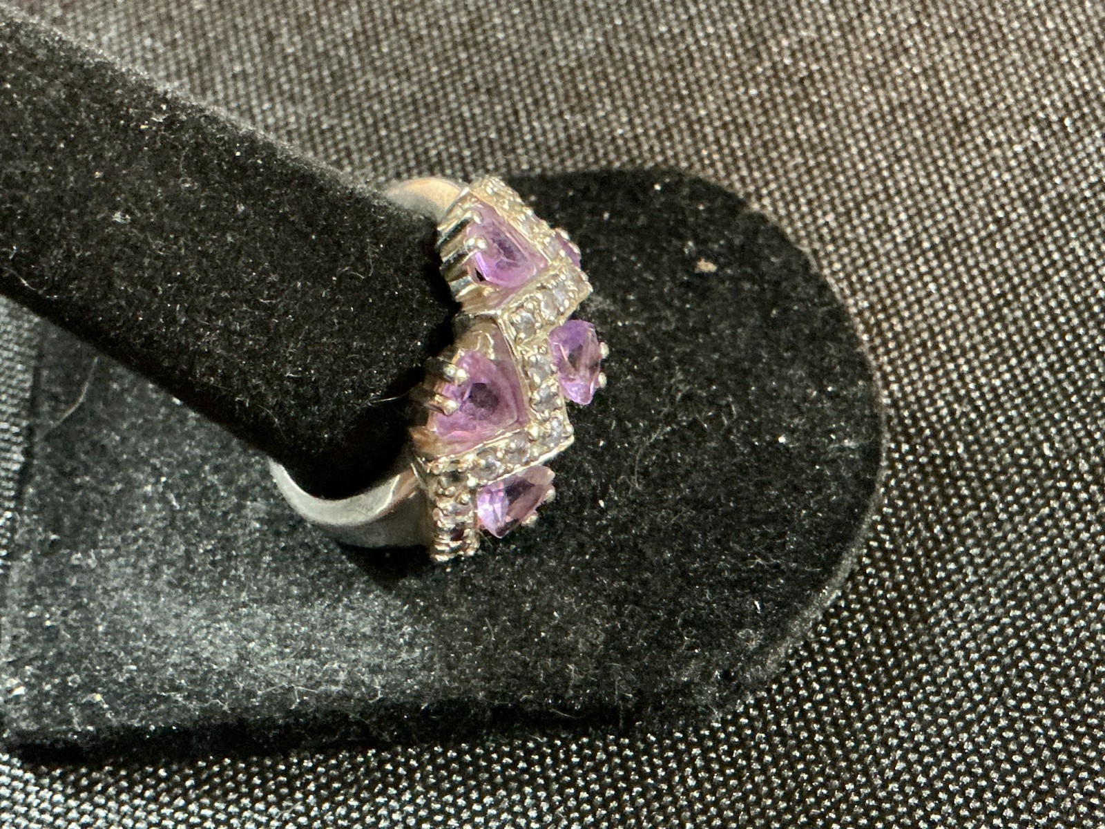 sterling silver ring features amethyst trillion-cut gemstones