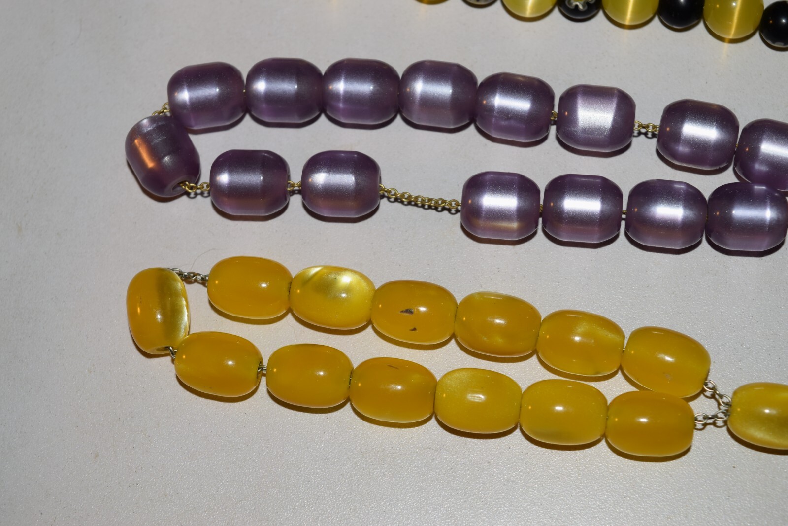 Vintage to now lot of 4 plastic beaded necklaces not sure what the 2 short ones