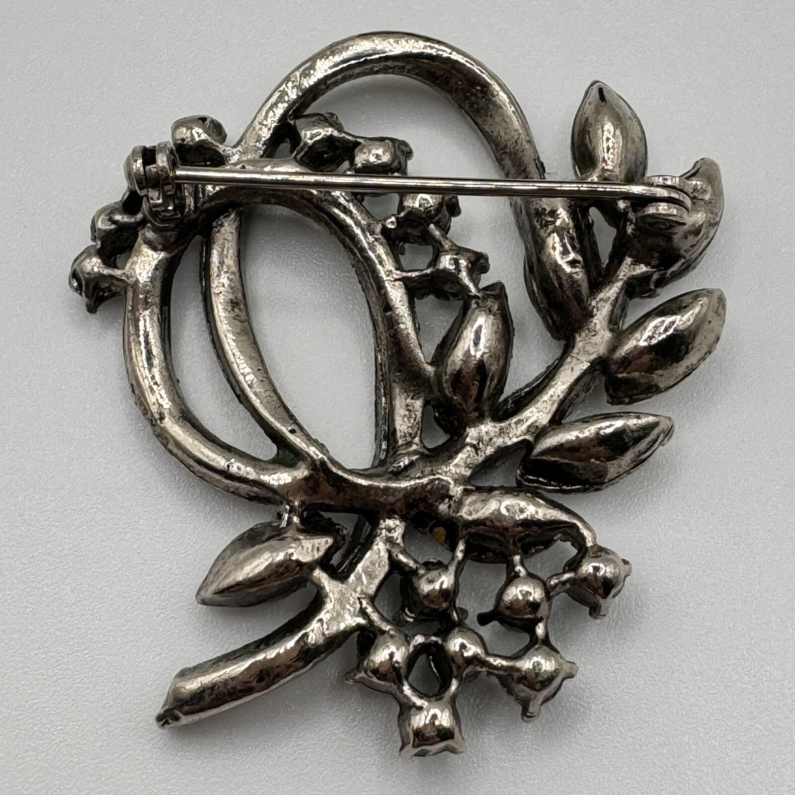 Floral Ribbon Swirl Green Clear Rhinestone Silvertone Brooch Pin