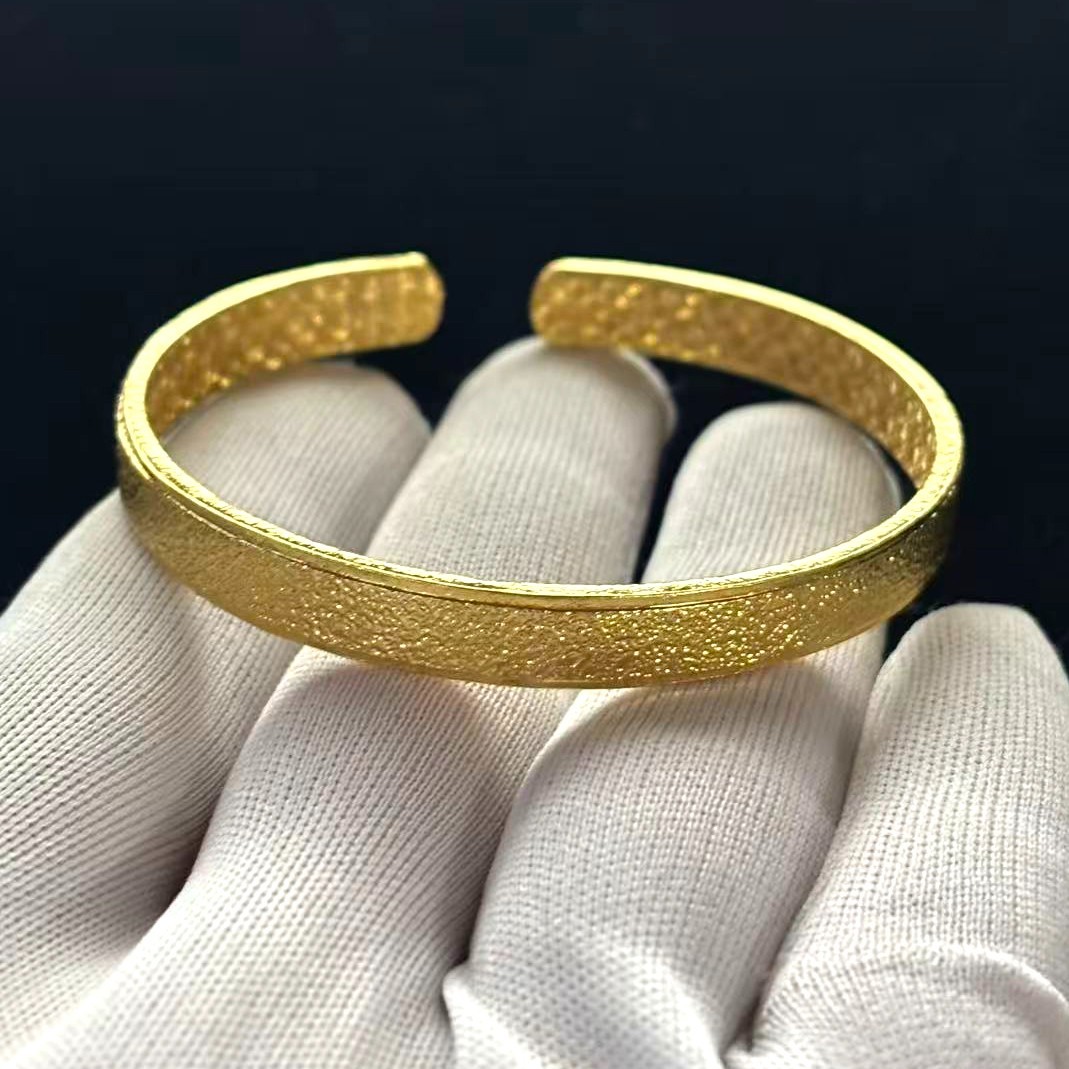 Golden Cuff Bangle Bracelet Gold-wash (NOT SURE) marked ‘999’, 7.5 in adjustable