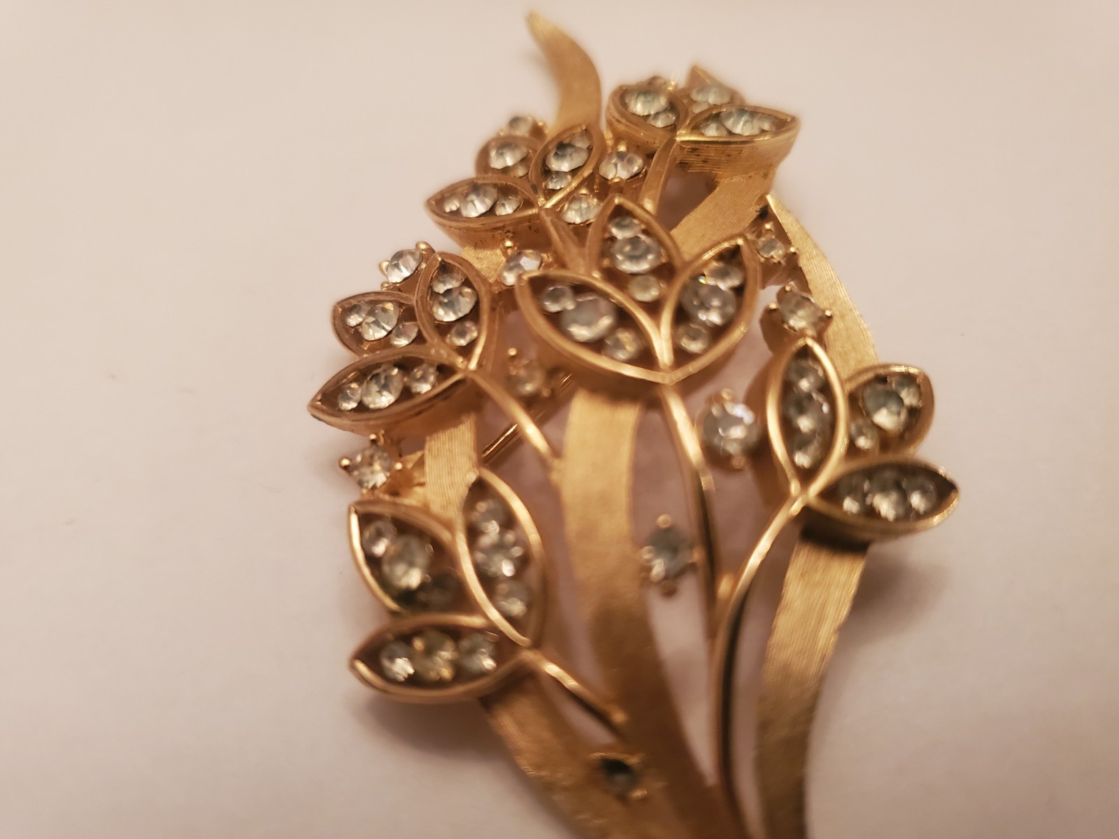 Vintage Trifari Brooch Features Floral Bouquet Design Crafted From Gold-Toned…