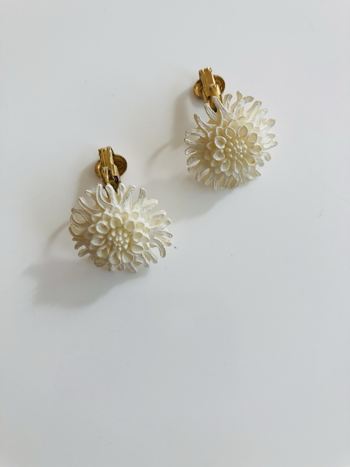 Vintage mid century MCM white celluloid floral clip on earrings