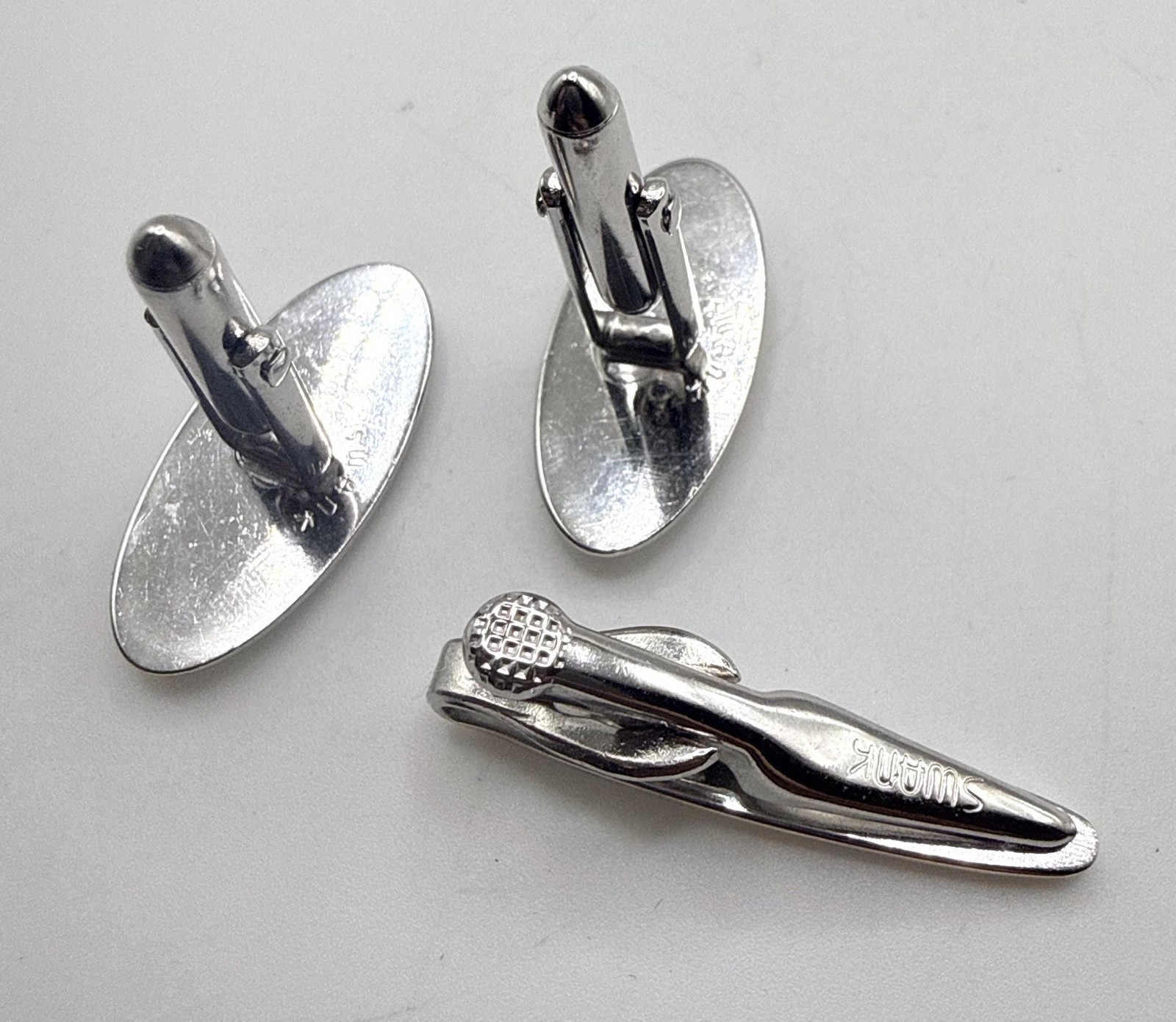 Vintage Swank silver tone textured elongated oval cuff links and tie clip set