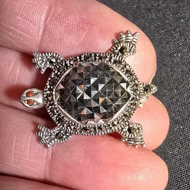 Sterling Silver Turtle Brooch features Marcasite Accents and Red Coral Eyes