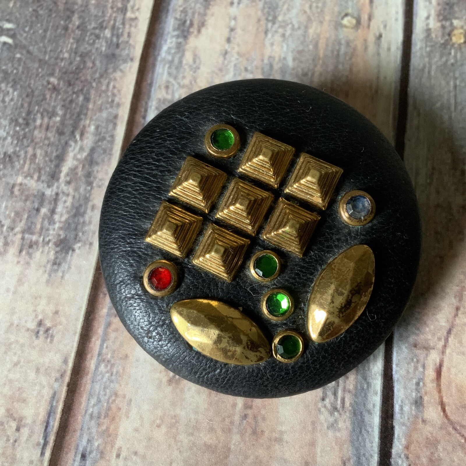 Vintage 1970s artisan made leather rhinestone modernist flower circle brooch