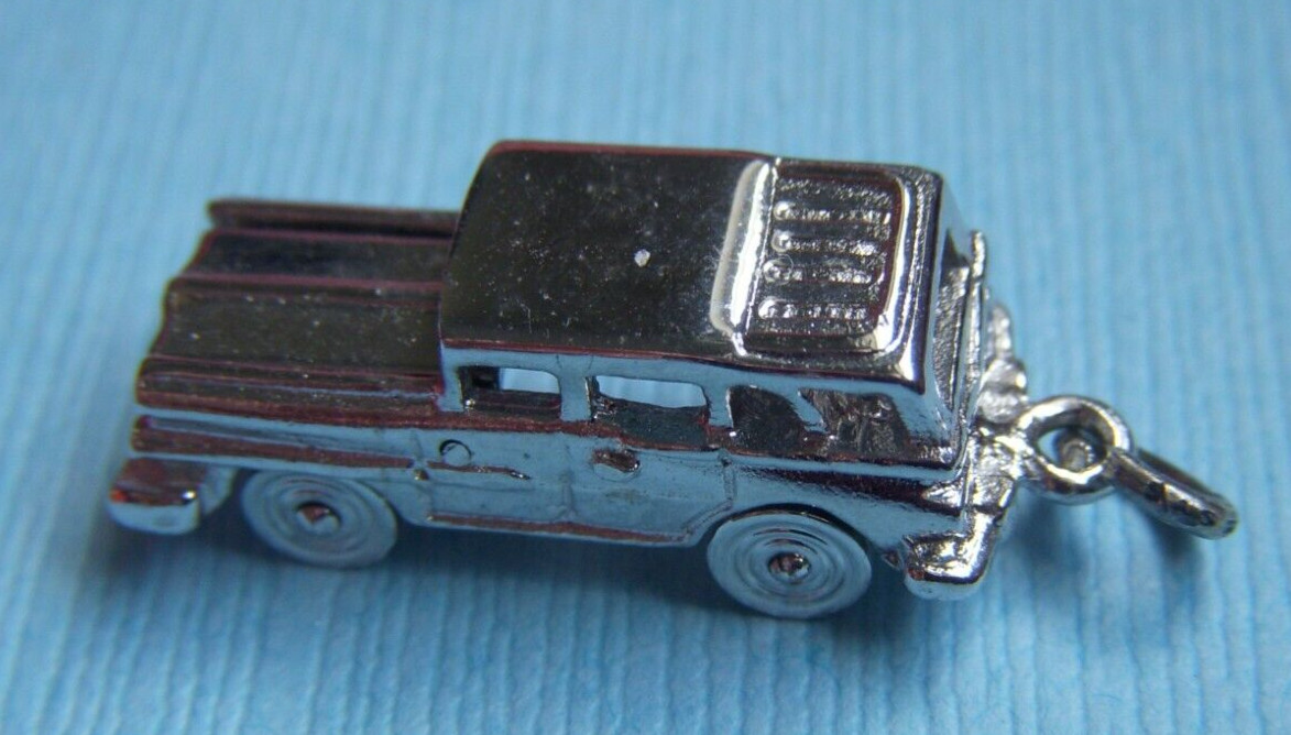 Vintage movable station wagon wheels move sterling charm
