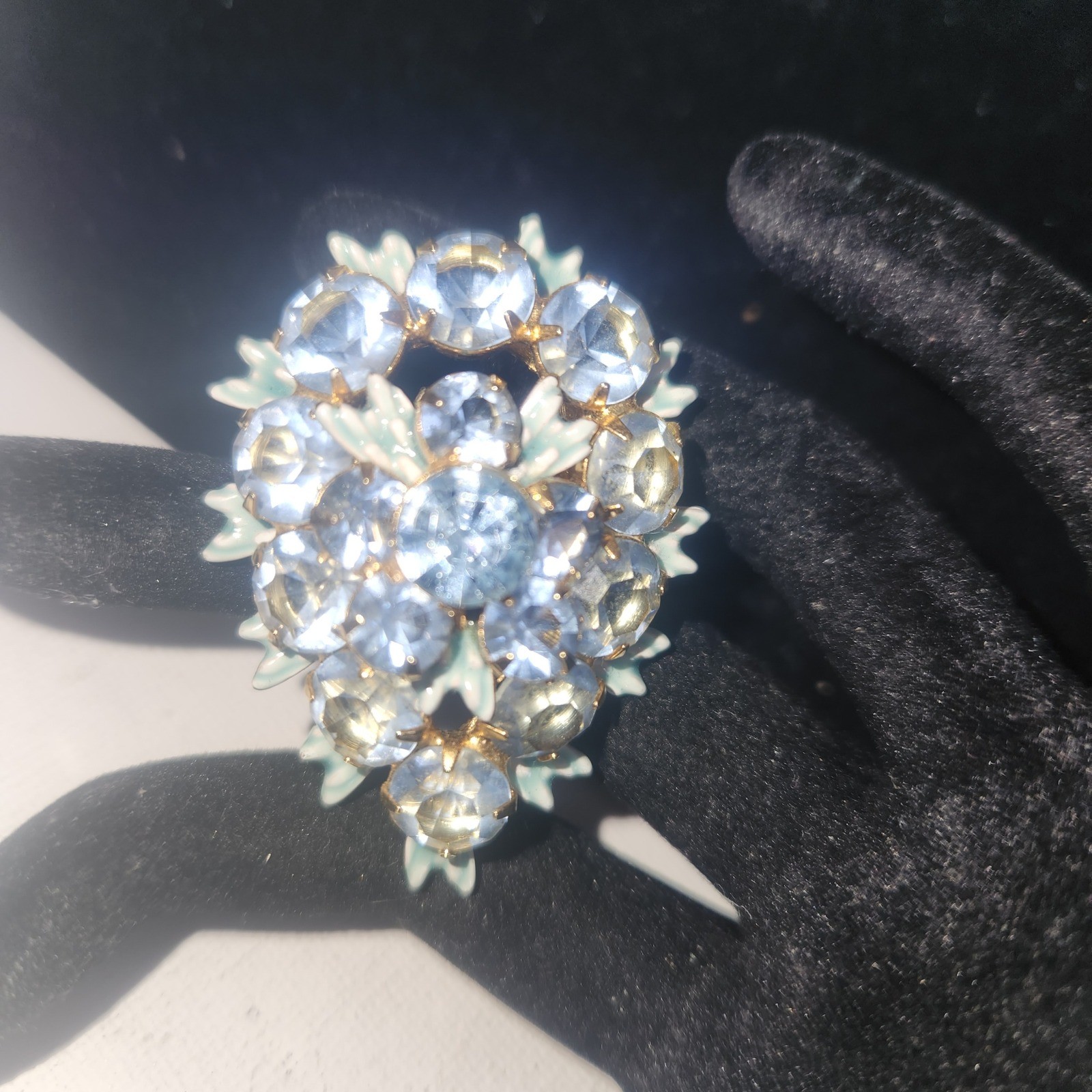 Vintage Light Blue Rhinestone Floral Cluster brooch Gold Tone Enamel Leaf Detail